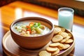 bowl of clam chowder with oyster crackers on side Royalty Free Stock Photo