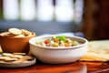 bowl of clam chowder with oyster crackers on side Royalty Free Stock Photo