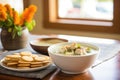 bowl of clam chowder with oyster crackers on side Royalty Free Stock Photo