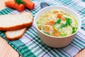 Bowl of clear chicken soup with noodle and vegetables Royalty Free Stock Photo