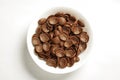 Bowl of cocoa crunch cornflakes on the white background