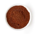 Bowl of coffee powder isolated on white, from above Royalty Free Stock Photo