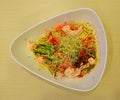 A bowl of cold Japanese pasta with fresh raw ingredients