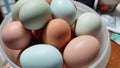 A bowl of colored eggs