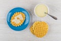 Bowl with condensed milk, wafer cookies with milk in saucer Royalty Free Stock Photo