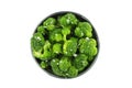 A bowl of cooked broccoli, isolated on a white background with a clipping path, shot from above Royalty Free Stock Photo