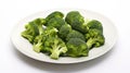 A bowl of cooked green broccoli with sea salt, shot from above on a white plate. Generative AI