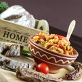 Bowl of cooked rice with red peppers and curry serverd with rye bread Royalty Free Stock Photo