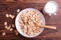 Bowl with corn flakes and glass of milk Royalty Free Stock Photo