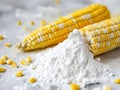 bowl with corn starch on kitchen table and ear of corn Royalty Free Stock Photo