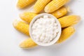 Bowl of corn starch and ripe cobs. Generate Ai