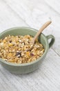 A bowl of cornflakes on a wood table