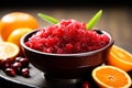 A bowl of cranberry relish with orange slices