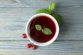 Bowl of cranberry sauce on gray wooden background Royalty Free Stock Photo