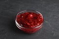 Bowl of cranberry sauce on grey background Royalty Free Stock Photo