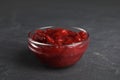Bowl of cranberry sauce on grey background Royalty Free Stock Photo
