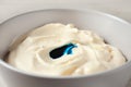 Bowl of cream with blue food coloring, closeup Royalty Free Stock Photo