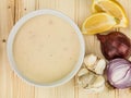 Bowl of Cream of Chicken Soup with Lemon Onion and Garlic Ingredients