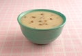 Bowl of cream of mushroom soup on table cloth Royalty Free Stock Photo