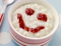 Bowl of Creamed Rice Pudding with a Strawberry Royalty Free Stock Photo