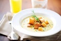 a bowl of creamy artichoke heart soup with croutons Royalty Free Stock Photo