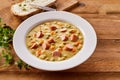 Bowl of Creamy Pea Soup with Chopped Sausage Royalty Free Stock Photo