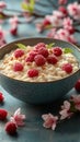 Creamy rice pudding with fresh raspberries and almonds adorned with cherry blossoms Royalty Free Stock Photo