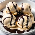 Bowl of creamy and rich vanilla ice cream with chocolate sauce