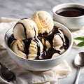 Bowl of creamy and rich vanilla ice cream with chocolate sauce