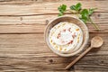 Bowl of creamy yogurt raita with coriander