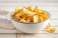 bowl of crispy and salted potatoes chips, ready to be devoured