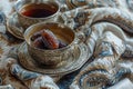 A bowl of dates, coffee and tea on a backdrop with a blanket Royalty Free Stock Photo