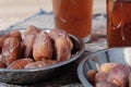 Bowl of dates fruit with glass of tea Royalty Free Stock Photo