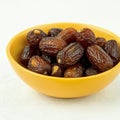 A bowl of dates, White Background, Royalty Free Stock Photo