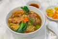 Bowl of delicious Chinese braised beef brisket noodle in restaurant Royalty Free Stock Photo