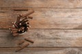 Bowl of delicious chocolate wafer rolls on wooden table, top view with space for text. Royalty Free Stock Photo