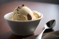 Bowl of delicious coffee ice cream on dark background