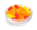 Bowl of delicious color jelly beans on white Royalty Free Stock Photo