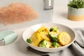 Bowl with delicious corn and broccoli on white wooden table. Sous vide cooking Royalty Free Stock Photo