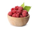 Bowl of delicious fresh ripe raspberries with leaves Royalty Free Stock Photo