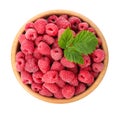 Bowl of delicious fresh ripe raspberries with leaves on white background Royalty Free Stock Photo