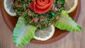 A bowl of delicious fresh Tabbouleh tabbouli salad with parsley, mint, tomato, onion, olive oil and lemon juice Royalty Free Stock Photo