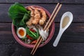 Bowl of delicious noodle soup with prawns