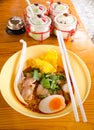 Bowl of delicious noodles with vegetables and boiled egg on woo Royalty Free Stock Photo