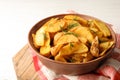 Bowl of delicious oven baked potatoes with dill, closeup