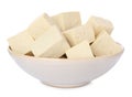 Bowl with delicious raw tofu pieces on white Royalty Free Stock Photo