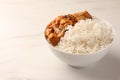 Bowl of delicious rice with meat and mushrooms on white table, space for text Royalty Free Stock Photo