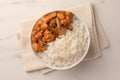 Bowl of delicious rice with meat and mushrooms on white marble table, top view Royalty Free Stock Photo