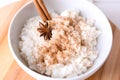 Bowl with delicious rice pudding and cinnamon powder, closeup Royalty Free Stock Photo