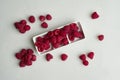 Bowl of delicious ripe raspberries on white background, top